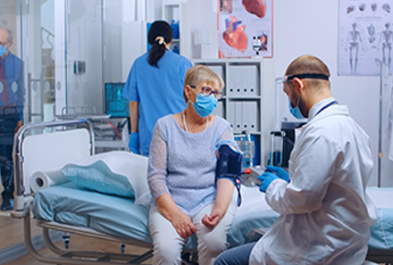 A Doctor is Taking the High Blood Pressure of a Urologic Procedure Patient